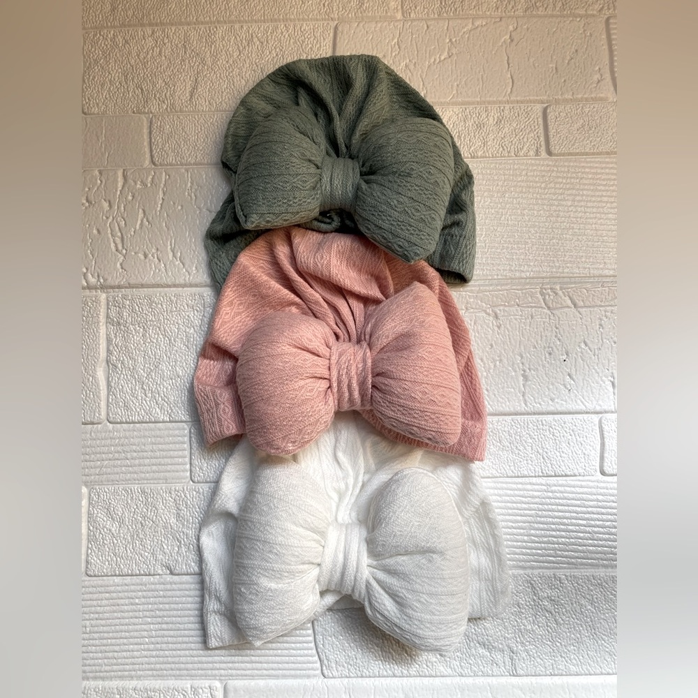 Three baby hats